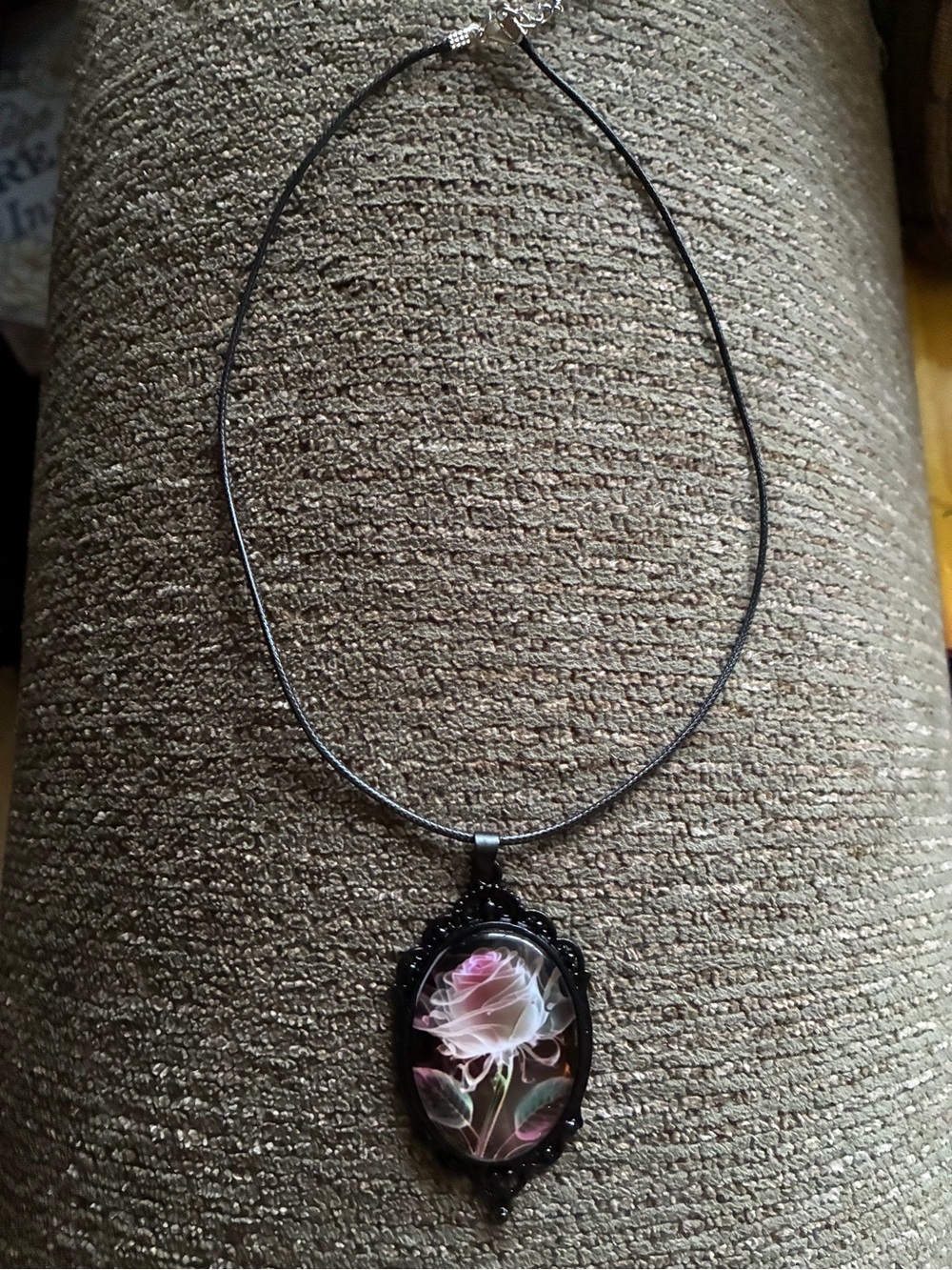 Pink rose in domed setting pendant, black filigree cameo accent, black 18” cord